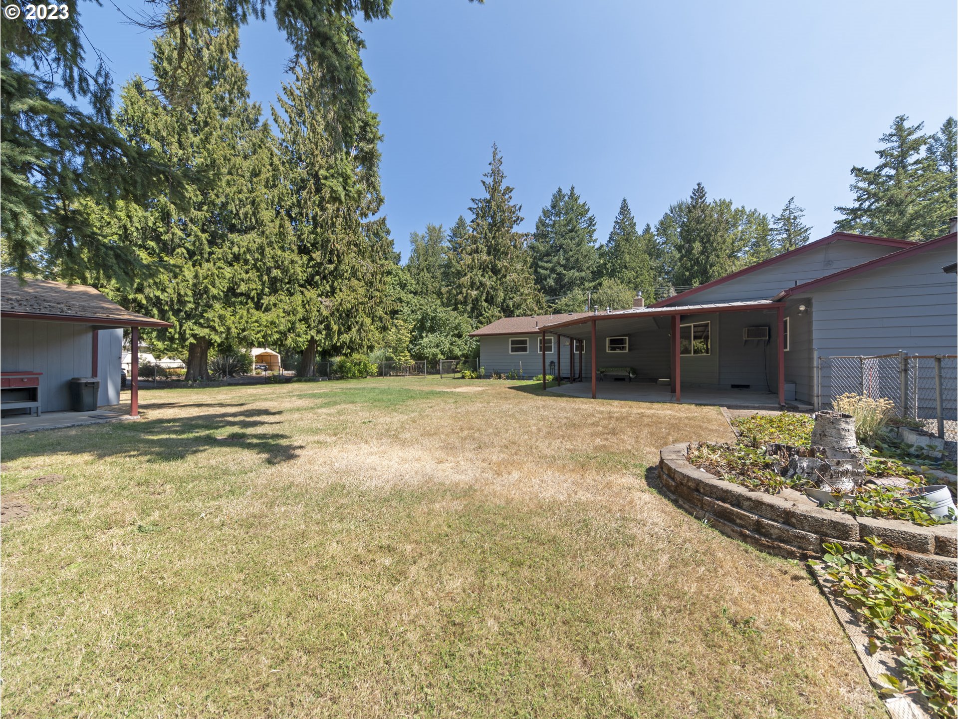 5685 Southwest River Road Hillsboro, OR 97123 - Photo 37 of 46 a view of a house with backyard and sitting area