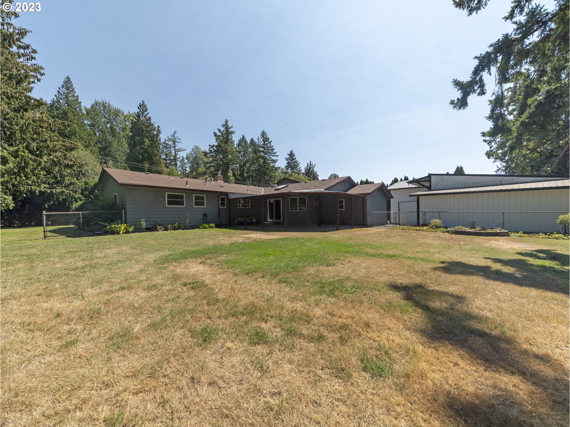 5685 Southwest River Road Hillsboro, OR 97123 - Photo 38 of 46 a view of a house with a yard