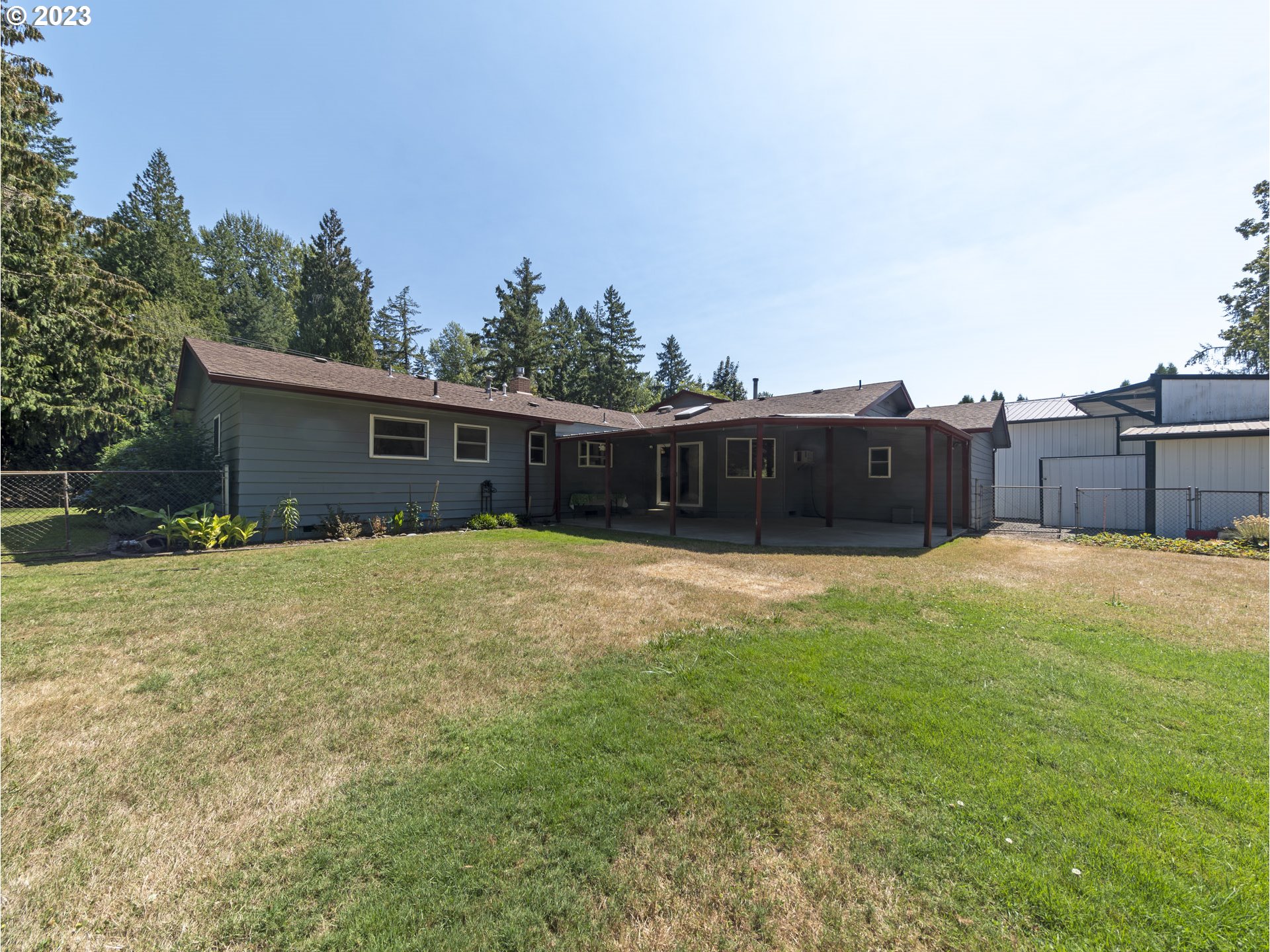 5685 Southwest River Road Hillsboro, OR 97123 - Photo 40 of 46 a swimming pool with outdoor seating and yard
