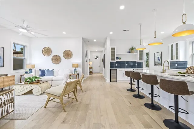 a large kitchen with a table and chairs in it
