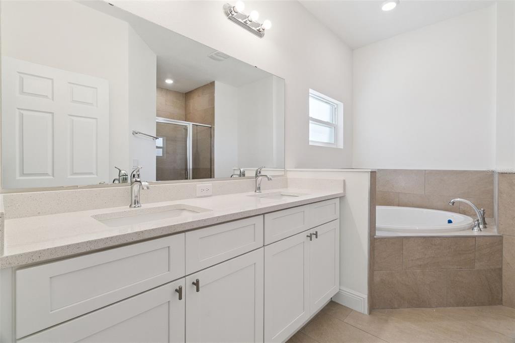 121 South Canoe Creek Road Kenansville, FL 34739 - Photo 28 of 54 a bathroom with a sink and a mirror