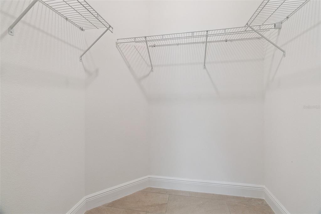 121 South Canoe Creek Road Kenansville, FL 34739 - Photo 31 of 54 a view of a room with racks on the wall