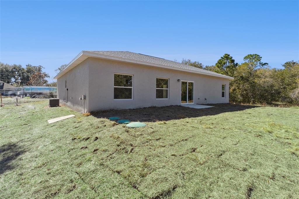 121 South Canoe Creek Road Kenansville, FL 34739 - Photo 35 of 54 a view of backyard of house