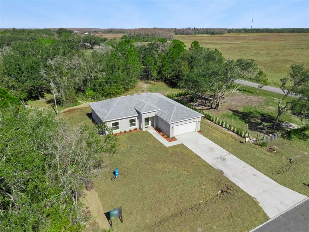 121 South Canoe Creek Road Kenansville, FL 34739 - Photo 44 of 54 an aerial view of a house