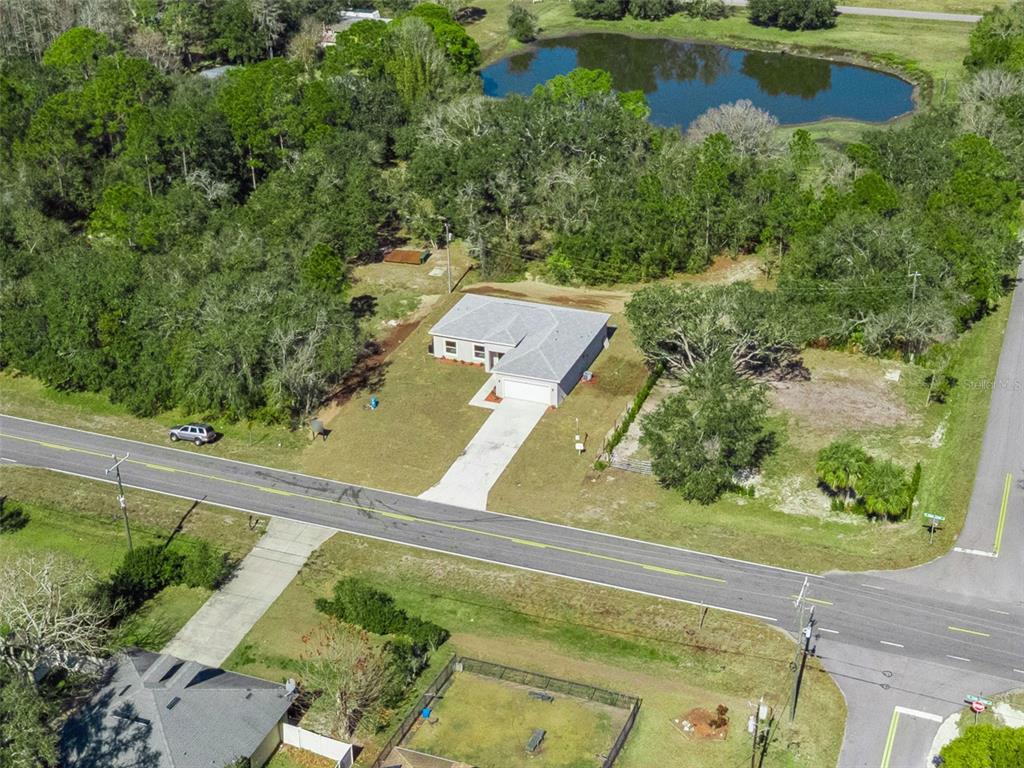 121 South Canoe Creek Road Kenansville, FL 34739 - Photo 46 of 54 an aerial view of a house