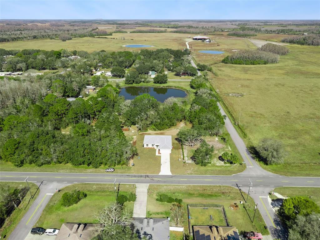 121 South Canoe Creek Road Kenansville, FL 34739 - Photo 54 of 54 an aerial view of residential houses with outdoor space