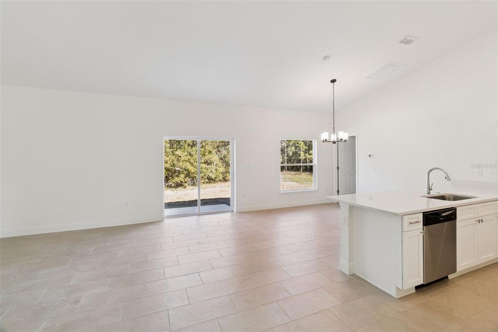 121 South Canoe Creek Road Kenansville, FL 34739 - Photo 8 of 54 a view of an empty room with a window