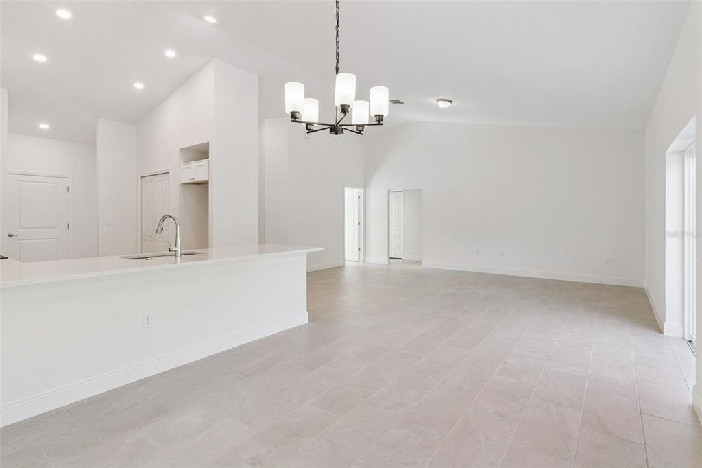 121 South Canoe Creek Road Kenansville, FL 34739 - Photo 9 of 54 a view of a kitchen with a sink and chandelier