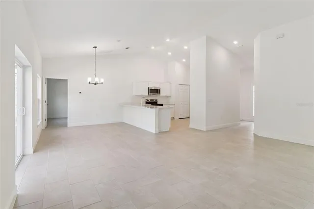 a kitchen with cabinets and window