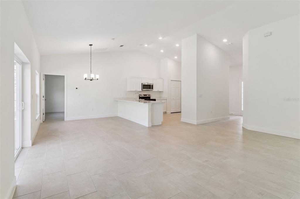 121 South Canoe Creek Road Kenansville, FL 34739 - Photo 10 of 54 a view of a kitchen with a sink and a window