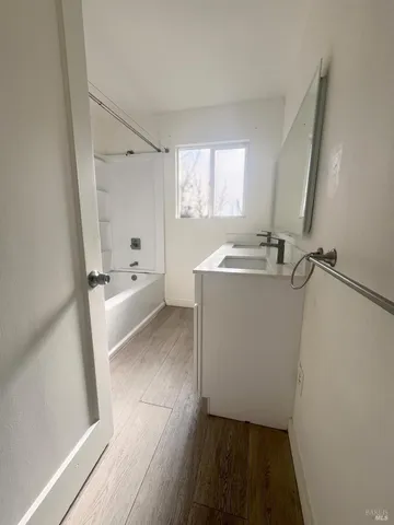 a bathroom with a sink a mirror and a toilet