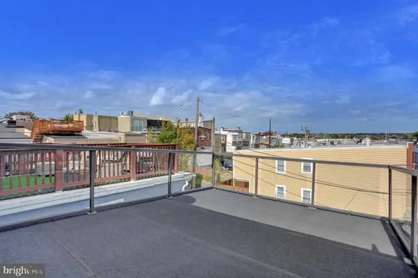 a view of a balcony with furniture