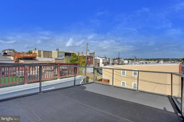 a view of a balcony with furniture