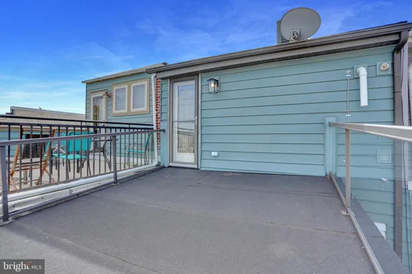a view of a house with a roof deck