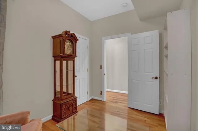 a view of front door with wooden floor