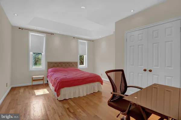 a bedroom with a bed and a chair