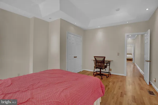 a bedroom with a bed and a chair