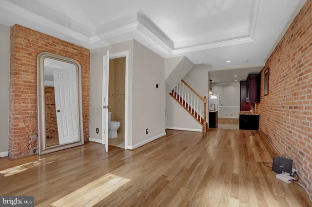 wooden floor in a hall with an entryway