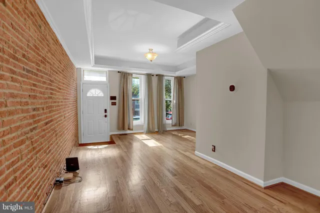 a view of a livingroom with wooden floor