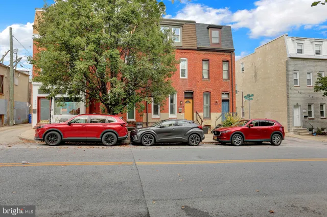 a view of street with parked cars