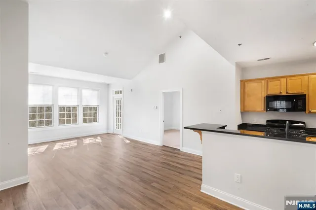 a view of a kitchen with a sink and a window