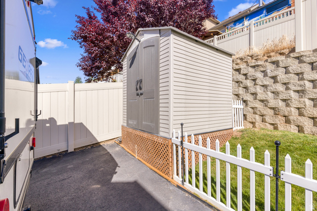 2005 Redtail Way Layton, UT 84040 - Photo 33 of 37 Exterior storage shed with double doors and lattice foundation skirting