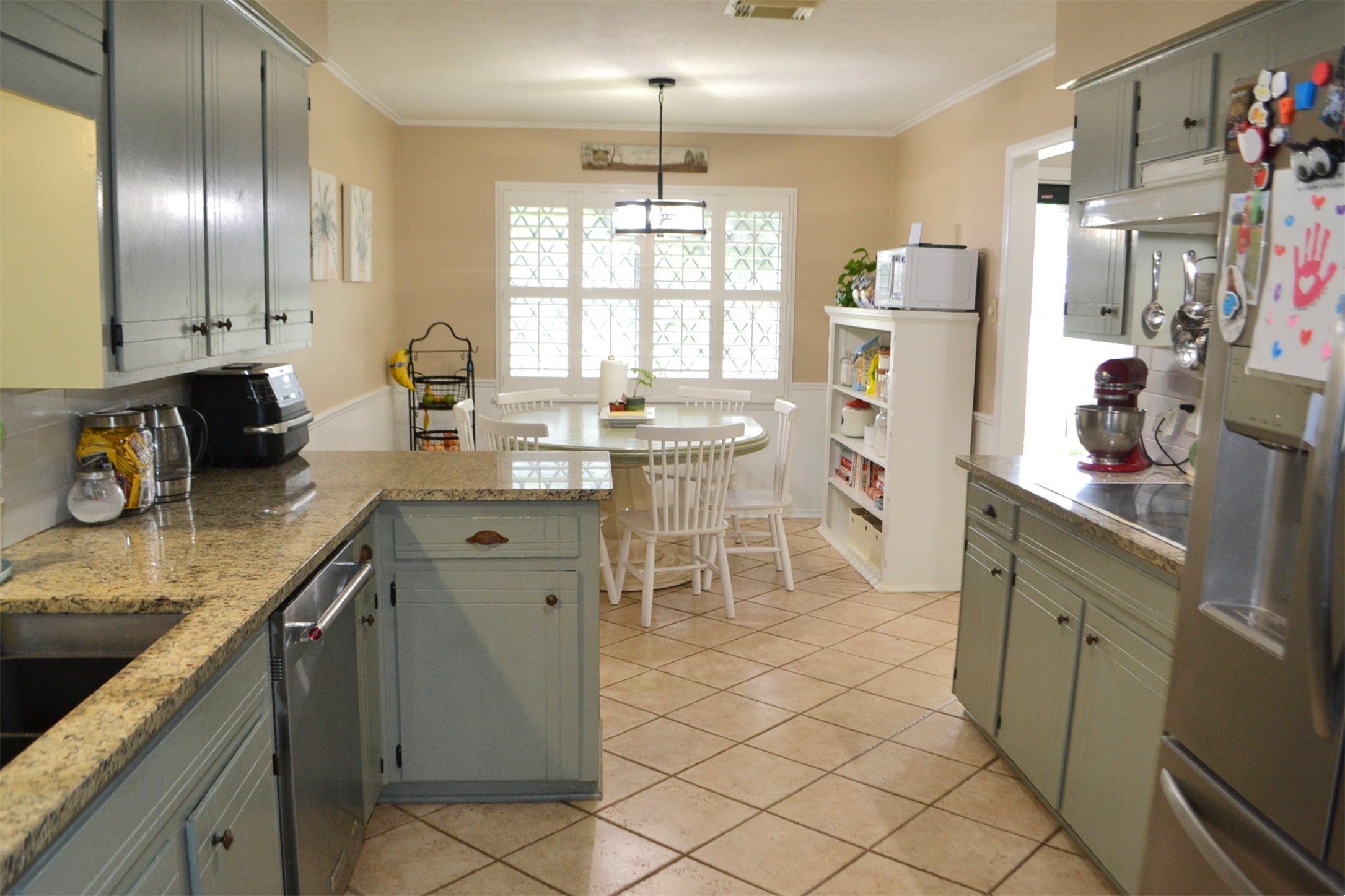 610 East X Street Deer Park, TX 77536 - Photo 13 of 44 a kitchen with sink cabinets and window