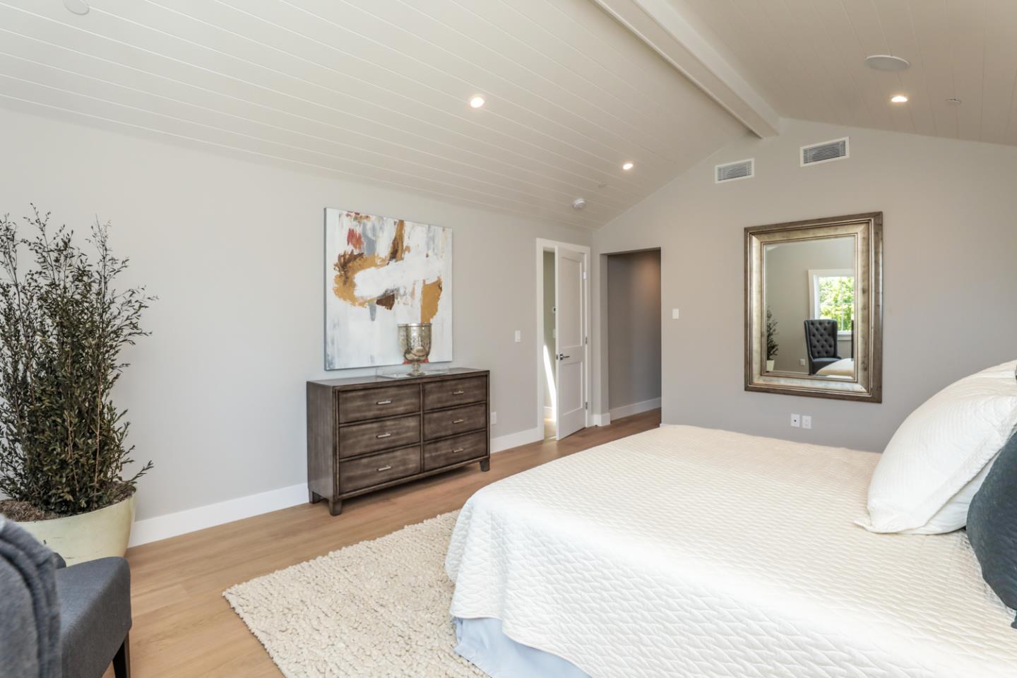 759 Sunshine Drive Los Altos, CA 94024 - Photo 28 of 47 a bedroom with a bed and a painting on the wall