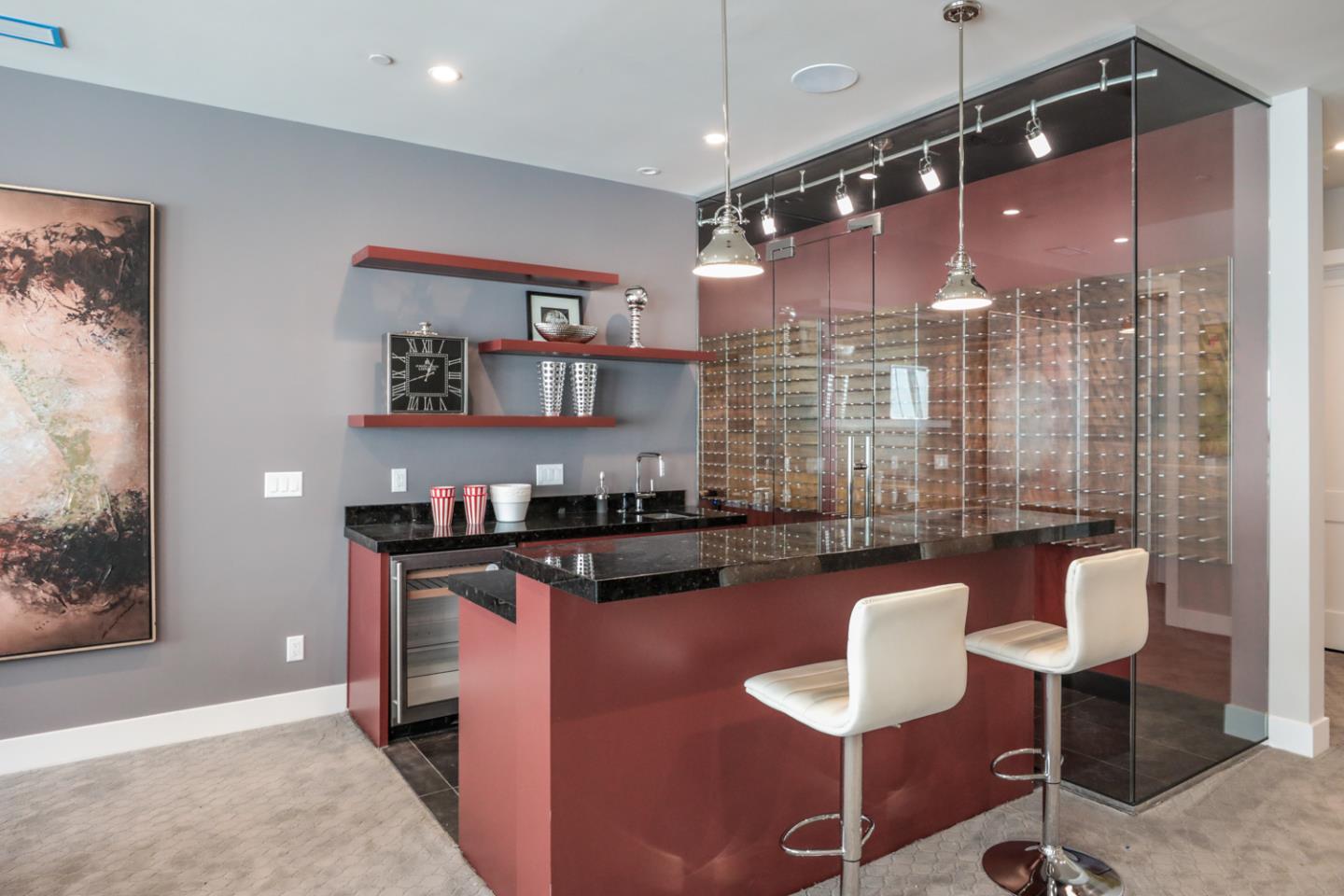 759 Sunshine Drive Los Altos, CA 94024 - Photo 38 of 47 a kitchen with granite countertop a table chairs stove and refrigerator