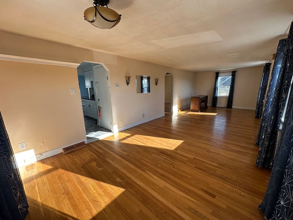 156 Parke Avenue Quincy, MA 02171 - Photo 11 of 23 a view of empty room with wooden floor