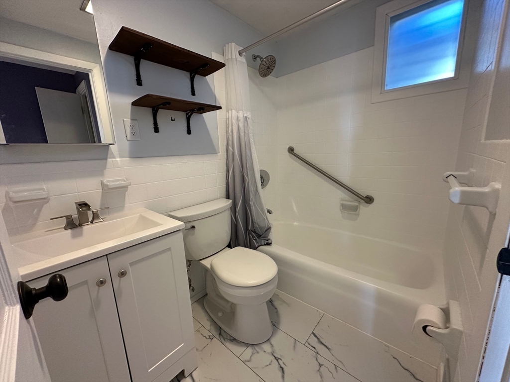 156 Parke Avenue Quincy, MA 02171 - Photo 13 of 23 a bathroom with a sink toilet and shower