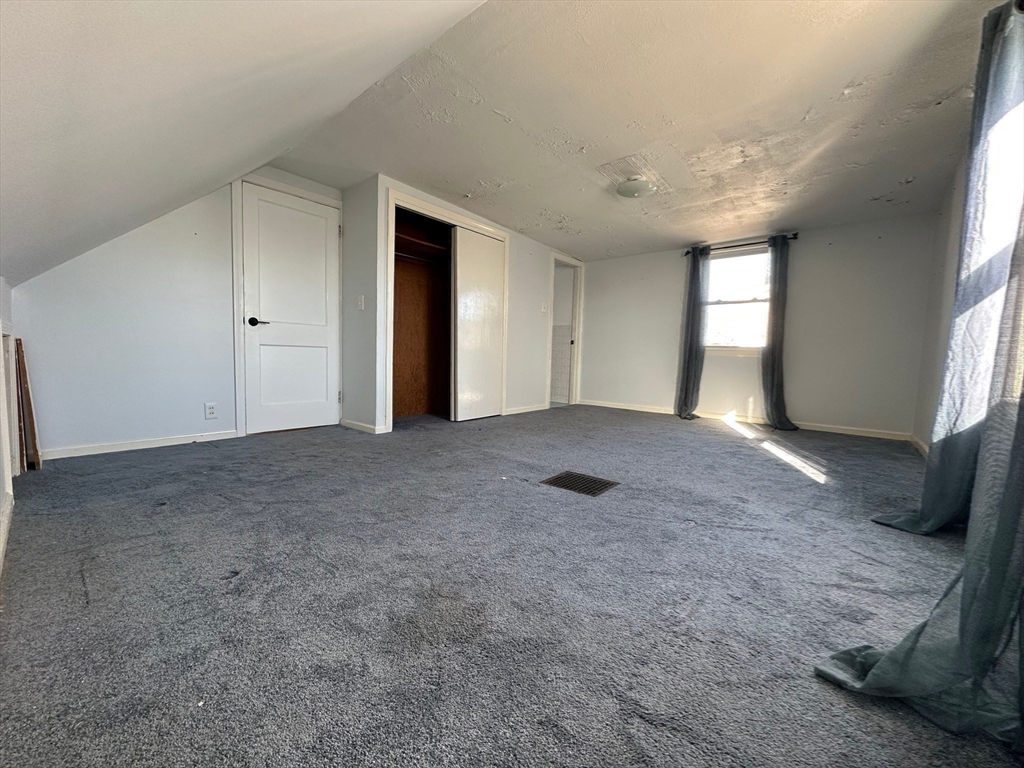 156 Parke Avenue Quincy, MA 02171 - Photo 19 of 23 a view of an empty room with a window
