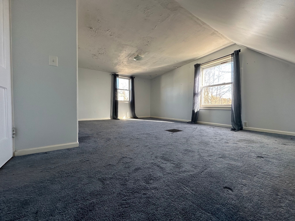 156 Parke Avenue Quincy, MA 02171 - Photo 20 of 23 an empty room with windows and closet
