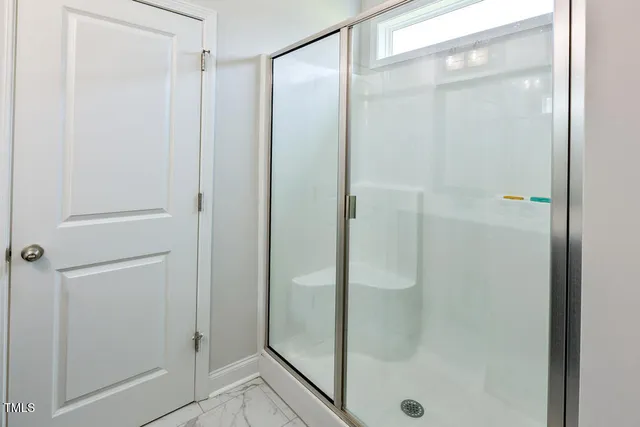 a view of a hallway with a white walls