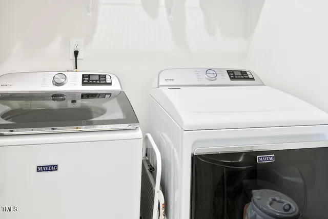 a view of a house with a wooden deck