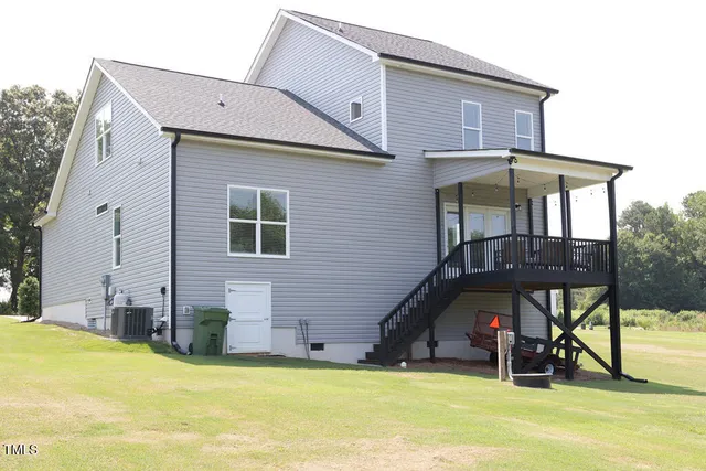 a aerial view of a house with a yard