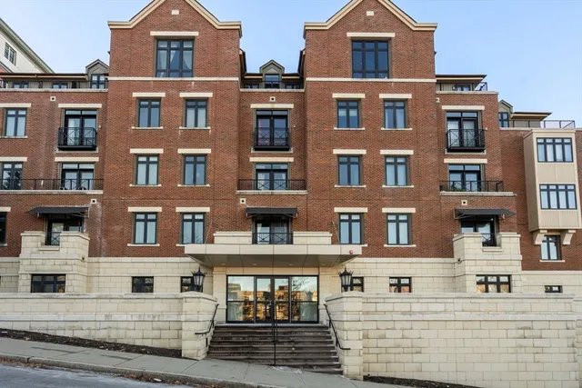 a front view of a building with glass windows