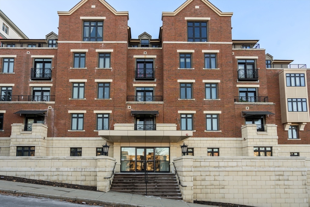 a front view of a building with glass windows