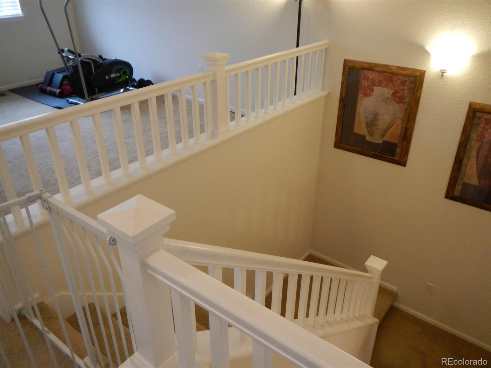 3652 South Perth Circle, Unit 102 Aurora, CO 80013 - Photo 14 of 17 a view of a hallway with staircase