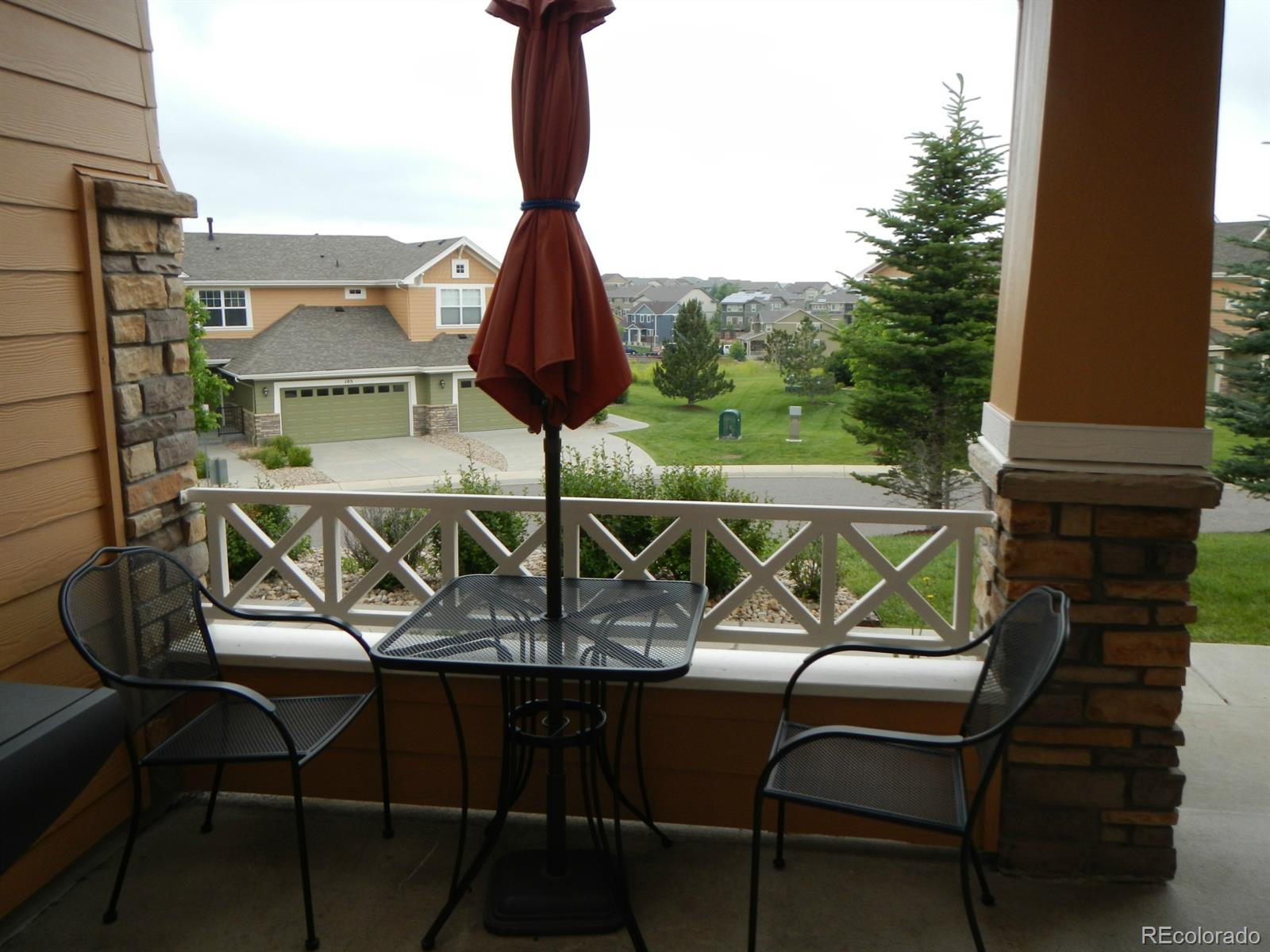 3652 South Perth Circle, Unit 102 Aurora, CO 80013 - Photo 16 of 17 a view of a chairs and table in the balcony