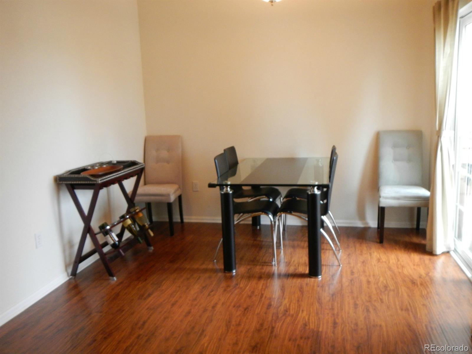 3652 South Perth Circle, Unit 102 Aurora, CO 80013 - Photo 8 of 17 a view of a workspace with furniture and wooden floor