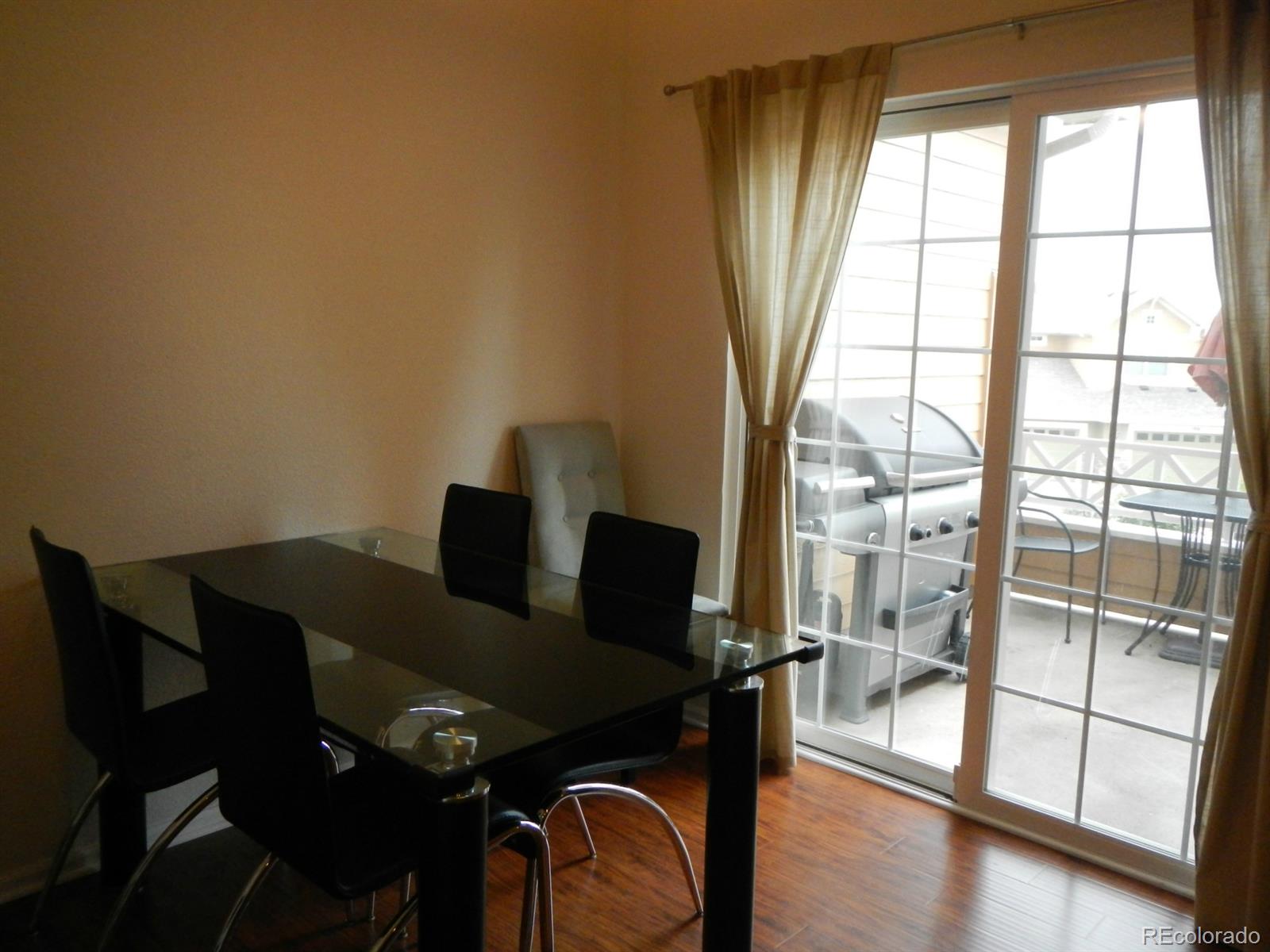 3652 South Perth Circle, Unit 102 Aurora, CO 80013 - Photo 9 of 17 a view of a workspace with furniture and a window