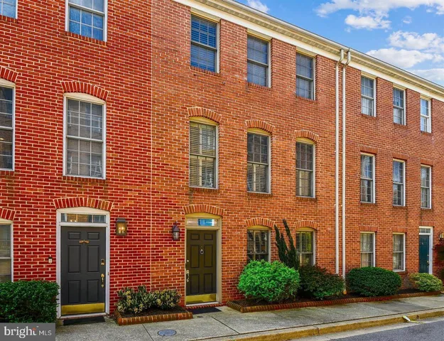a front view of a building with garden