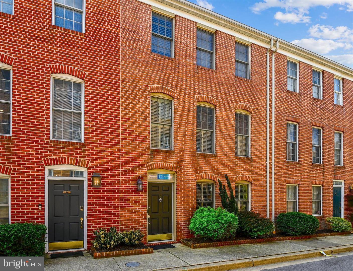 a front view of a building with garden