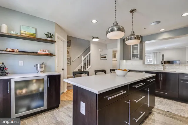 a living room with furniture a rug and a fireplace