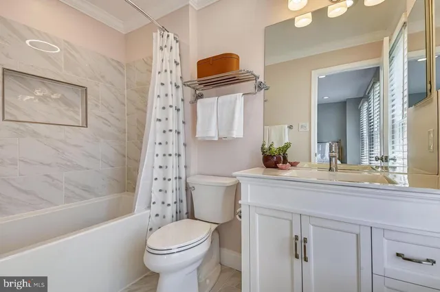 a view of a chairs and table in the balcony