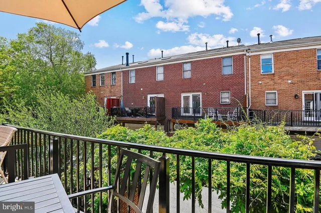a view of a chairs and table in the patio