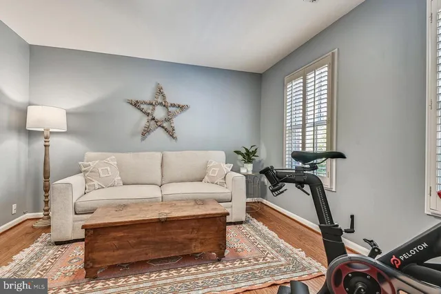 a kitchen with stainless steel appliances kitchen island granite countertop a sink a stove a dining table and chairs