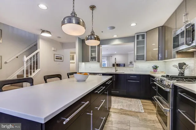 a kitchen with a stove and a sink