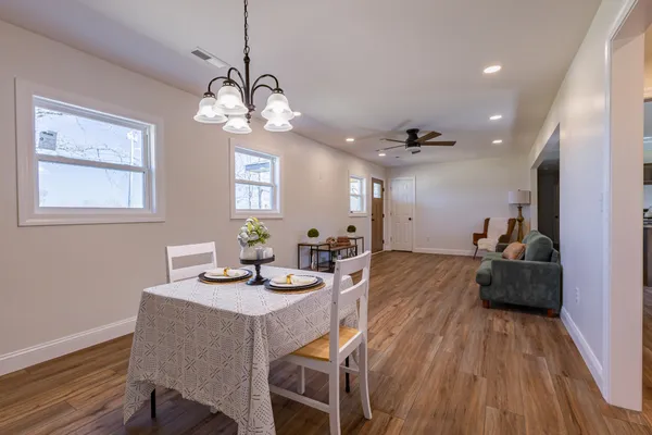 a view of a dining room with furniture window and wooden floor